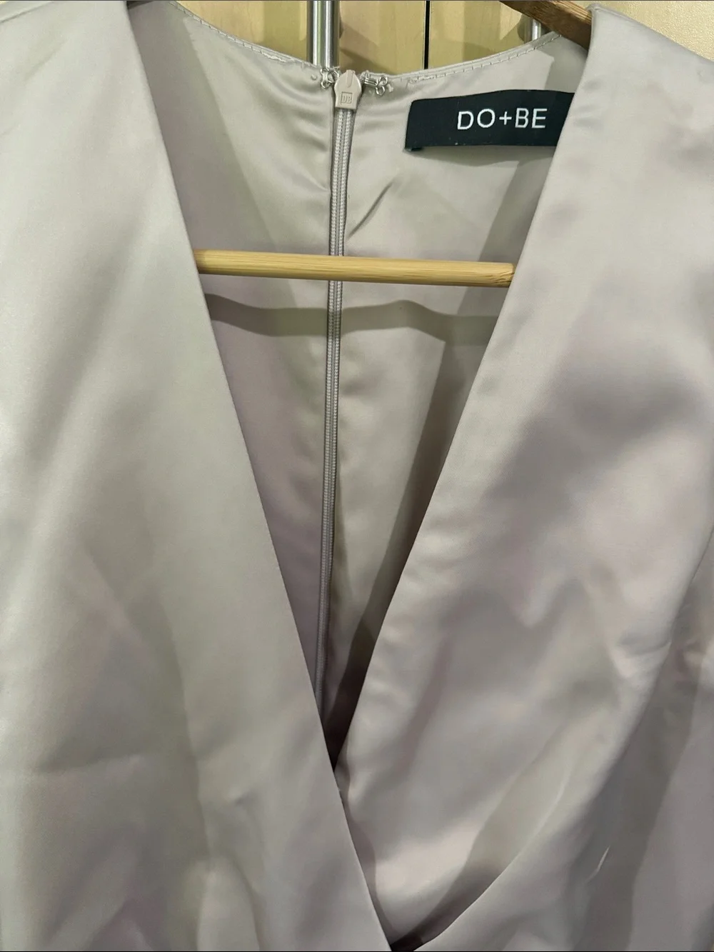 DO+BE Sleeveless elegant Draped Satin V-Neck Romper in golden cream.